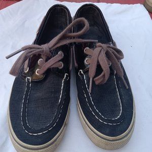 Black Sperry's with brown strings.